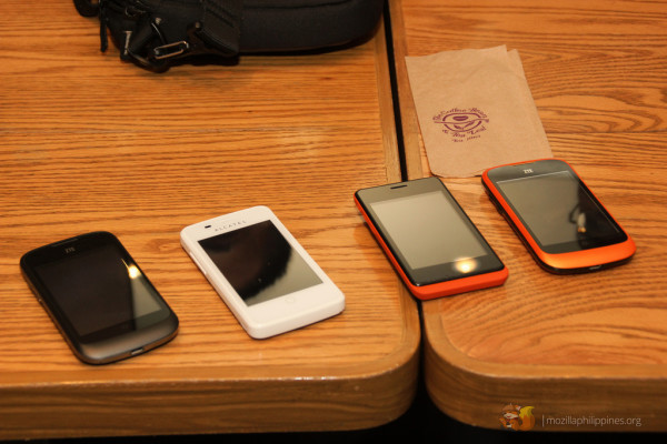 Devices running on Firefox OS: [L-R] ZTE Open, Alcatel OneTouch Fire, Geeksphone Keon, and a ZTE Open (eBay exclusive orange color).