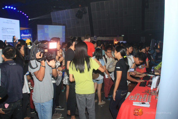 The MozillaPH booth gets visited by a local news channel crew ...