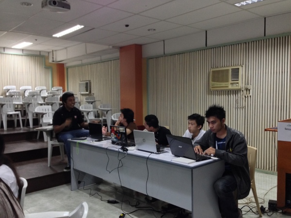 Kevin giving his words of encouragement to a team participating at Startup Weekend Cagayan De Oro.