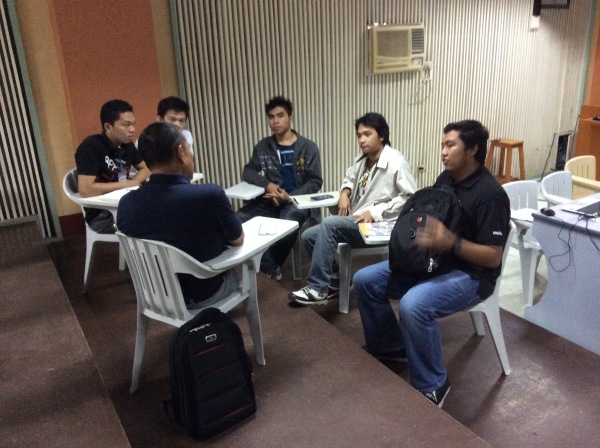 Kevin participates in a group discussion and mentoring session.